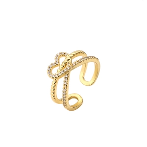 Gold plated double-layered heart ring with white zircon stones on white background