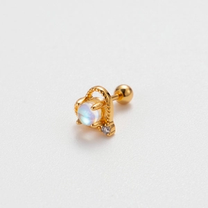 Close-up of golden moonstone helix earring with crown design and screw back