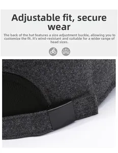 Detail of the adjustable black buckle on a thick grey wool cap for a custom fit