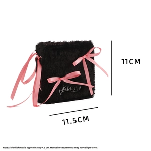 Detail view of plush photo album with pink ribbons and dimensions 11x11.5x4.5cm