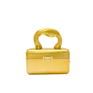 Elegant gold acrylic box clutch with a unique curved handle and glossy metallic finish