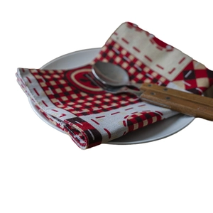 Christmas American style red and black buffalo plaid placemat with cutlery on white plate