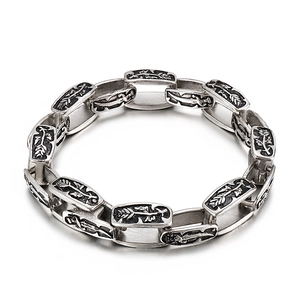 Vintage punk stainless steel bracelet with engraved patterns on white background