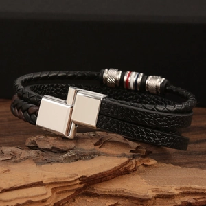 Men's multilayer braided leather bracelet with silver magnetic clasp on wood bark