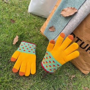 Winter thermal knit gloves in yellow with blue polka dot cuffs and touch screen fingertips