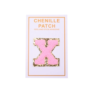 Close-up of pink chenille letter X patch with gold sequins and self-adhesive backing