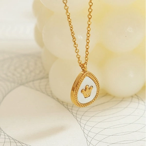 Elegant gold titanium steel teardrop necklace with crown motif and white shell inlay