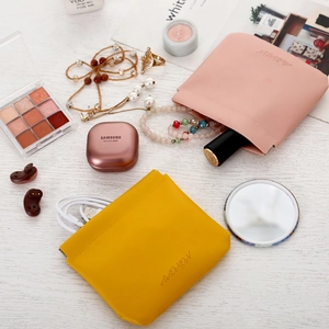 Pink and yellow PU leather squeeze cosmetic pouches with automatic closing mechanism