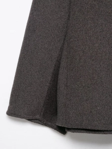 Detailed close-up of dark grey wool fabric texture and weave for women jacket coat