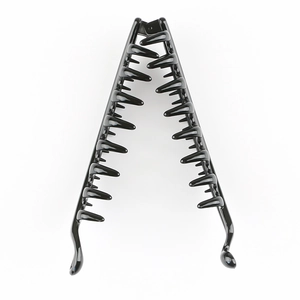 Detailed view of a large black glossy banana hair clip with internal comb teeth on white back