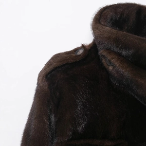 Women's dark brown faux rabbit fur coat with luxury shoulder buttons and plush texture