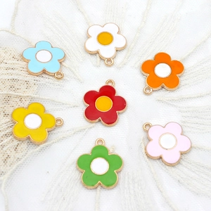 Colorful enamel sunflower alloy pendants for DIY jewelry making on white lace background