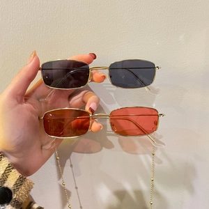 Retro rectangle metal sunglasses with gold frames and hanging chain in black and red lenses