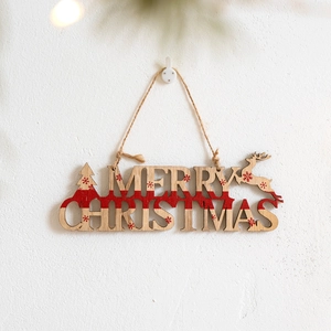 Wooden Merry Christmas sign hanging with reindeer and tree motifs for holiday decor