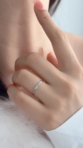 Macro detail of minimalist S925 sterling silver geometric stackable ring on finger