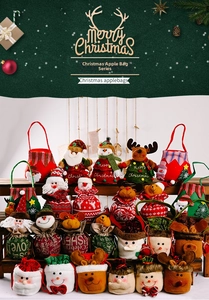 Detailed close-up of festive Christmas gift bags with Santa, reindeer and snowman designs