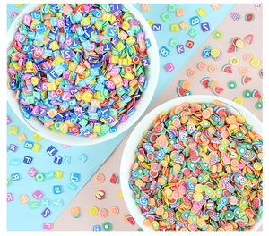 Close-up of 5mm colorful fruit and alphabet polymer clay slices for DIY craft accessories