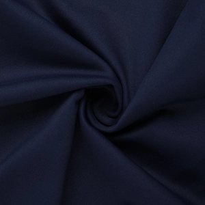 Detailed close-up of dark blue dress fabric showing soft texture and premium silk-like sheen
