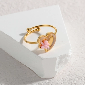 Golden open ring featuring an acrylic relief heart with pink flower on stone