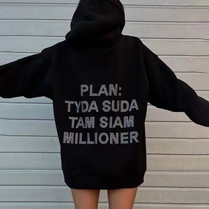 Macro detail of the rhinestone lettering design on the back of this black hooded sweatshirt