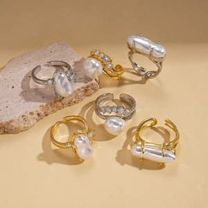 Baroque pearl layered adjustable rings with zircon and gold finish on stone display