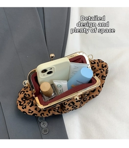Interior view showing the large storage capacity of the leopard print shell bag