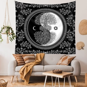 Detailed view of large black and white tapestry with Tree of Life and sun moon patterns