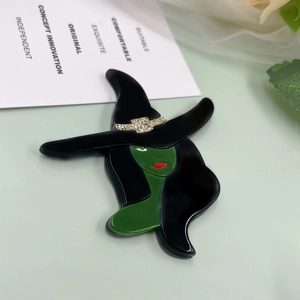 Exquisite green witch brooch pin with black hat and golden glitter details for suit decor