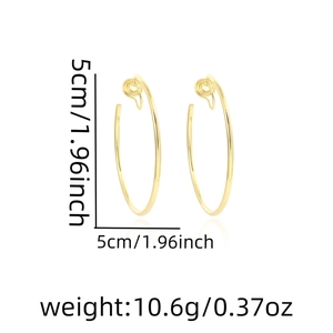 Detail shot of 5cm gold hoop clip-on earrings with size and weight measurement markings