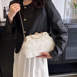 Elegant white evening clutch bag featuring 3D rose floral design with a gold chain strap