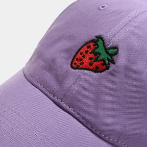 Purple cotton baseball cap featuring detailed strawberry embroidery and curved brim