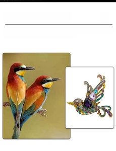 Detail of colorful crystal bird brooch showing vibrant rhinestones and golden metalwork