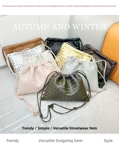 Detailed view of assorted woven leather bucket bags with drawstring closure in multiple colors