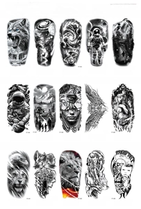 Macro view of 15 black and white temporary tattoo designs including wolf and lion motifs