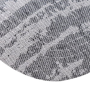 Close-up of the stitching and black and white checkered fabric on the baseball cap brim