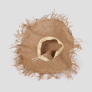 Detail of adjustable drawstring and sweatband inside the wide-brim straw hat