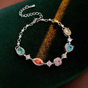 Detailed view of colorful oval zircon flower bracelet with adjustable silver chain link