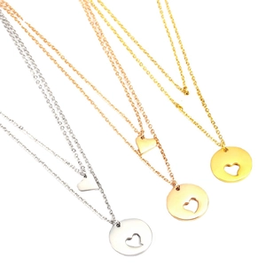 Double-layered heart pendant necklaces in silver, rose gold, and 18K gold finishes