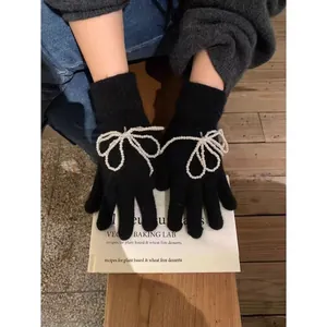Korean style black knitted gloves featuring elegant 3D white pearl bow decorations