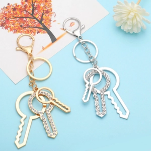 Elegant gold and silver alloy keychain set with sparkling rhinestones and key charms