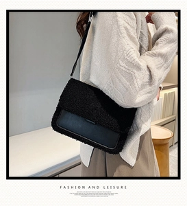 Detail of black faux fur and leather contrast crossbody bag worn with beige sweater