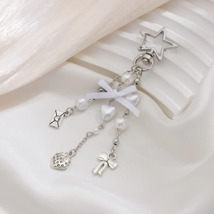 Creamy style keychain with white bow strawberry charms and silver star buckle for bags