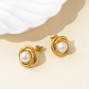 French style gold spiral pearl stud earrings featuring a minimalist vintage floral design