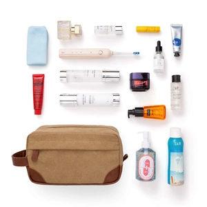 Large vintage canvas and PU leather toiletry bag for men, organized for travel.