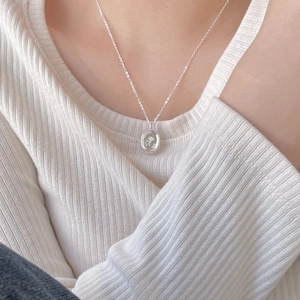 Minimalist 925 sterling silver necklace featuring an oval rose embossed flower pendant