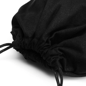 Close-up of black canvas drawstring storage bag with dual cord closure and texture detail