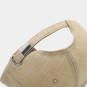 Close-up of khaki baseball cap with adjustable metal buckle and twill fabric texture