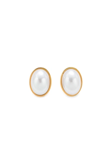 Detailed close-up of oval white pearl earrings with elegant gold metallic borders