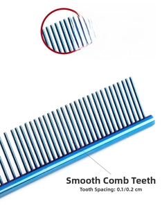 Detail of blue stainless steel pet comb with rounded teeth for skin protection