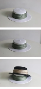 Detail showing flat top boater hats in straw with champagne gold and sage green ribbons